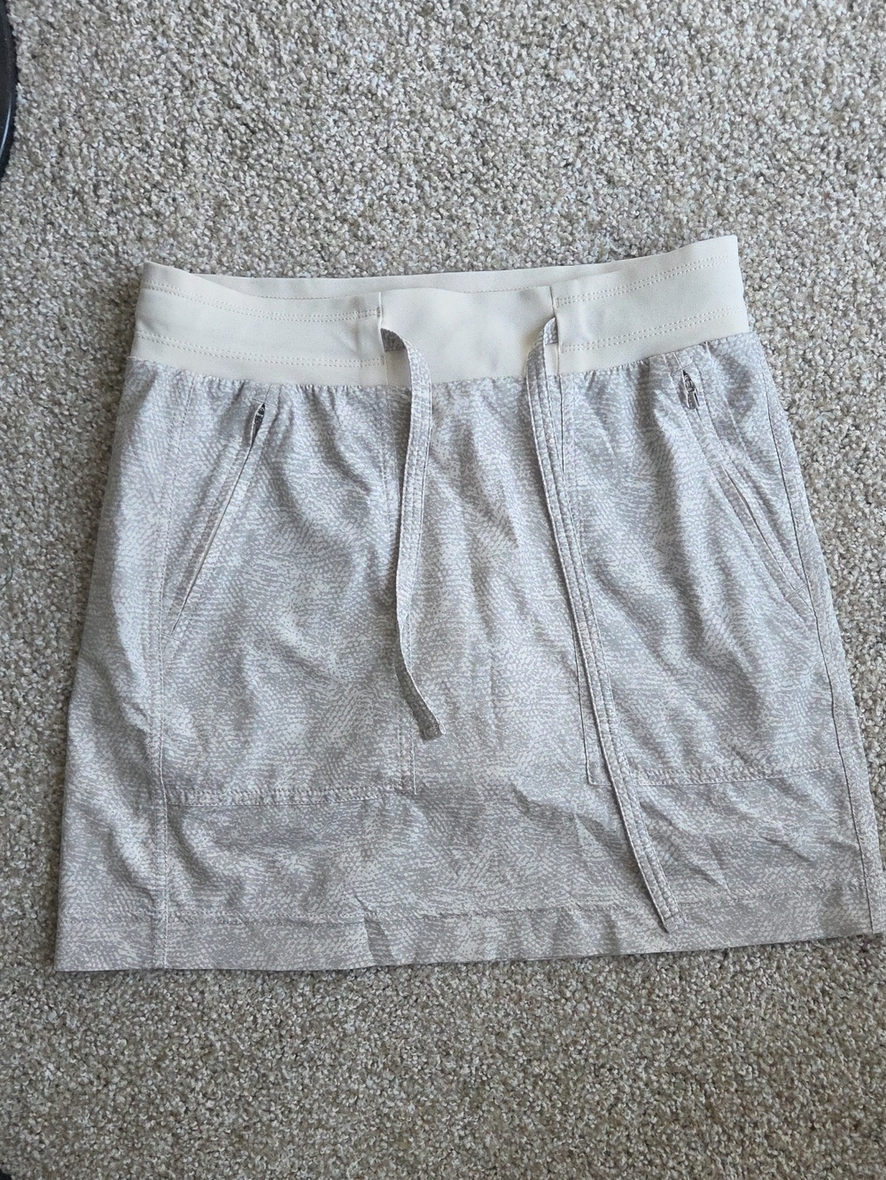 Athleta Cream Drawstring Mini Skirt with Zip Pockets